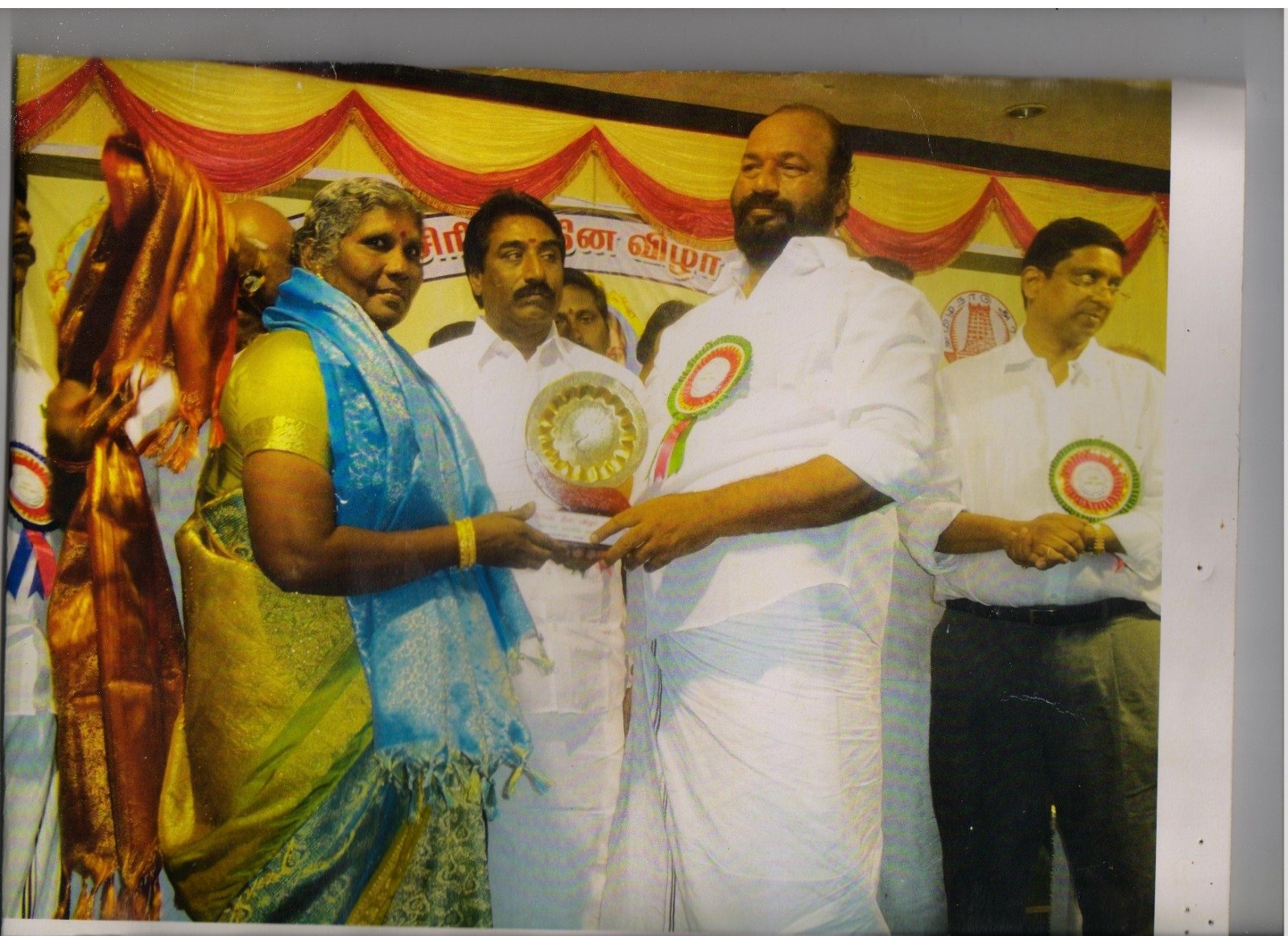 An archival photograph of the school's founding family honoured on stage